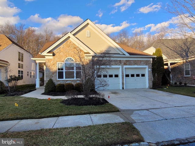 front facade with a front lawn and a garage