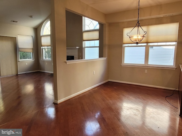 unfurnished dining area featuring dark hardwood / wood-style floors