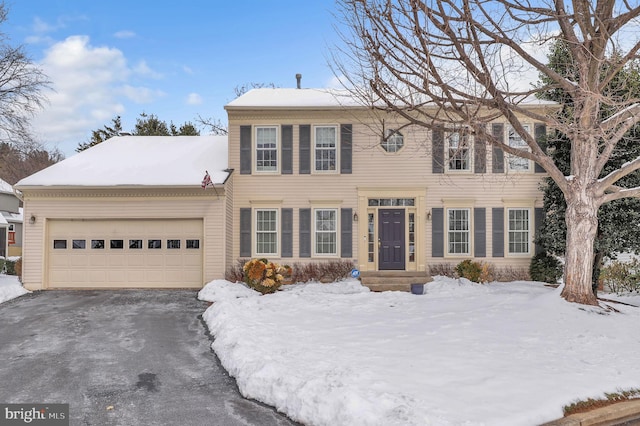 colonial home featuring a garage