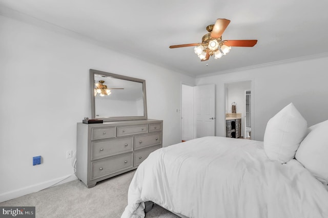 carpeted bedroom featuring ceiling fan, crown molding, and connected bathroom