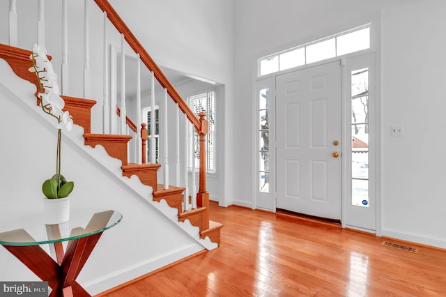 entryway featuring light hardwood / wood-style floors and a healthy amount of sunlight