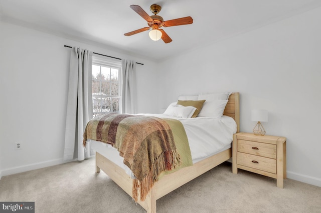 bedroom featuring ceiling fan and light colored carpet