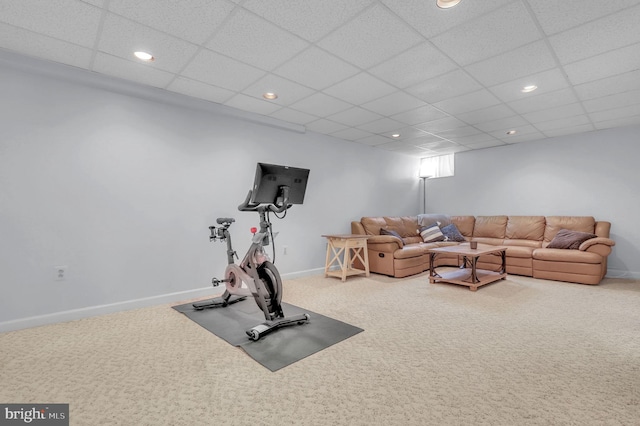 exercise area featuring a paneled ceiling and carpet floors