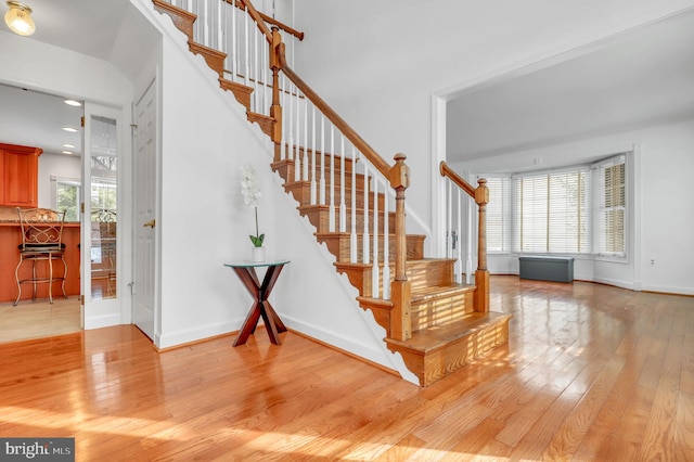 stairs featuring hardwood / wood-style flooring