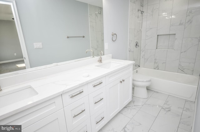 full bathroom featuring vanity, toilet, and tiled shower / bath