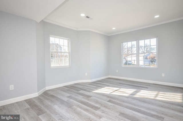 unfurnished room featuring light hardwood / wood-style floors and ornamental molding