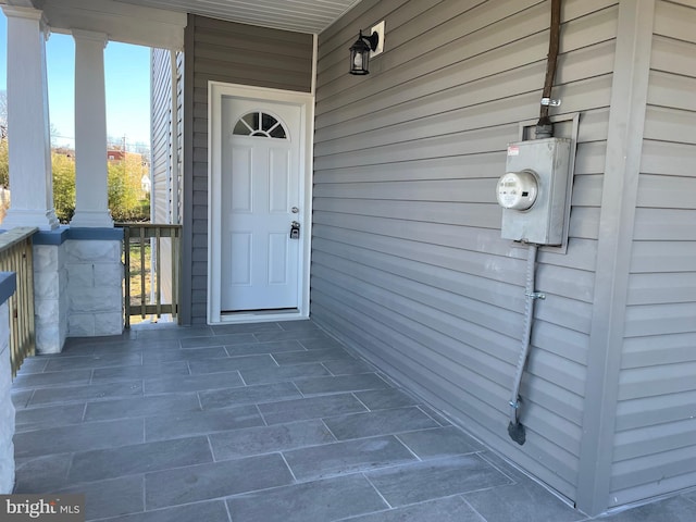 doorway to property featuring a porch