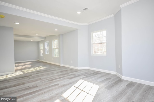 unfurnished room with light hardwood / wood-style floors and ornamental molding