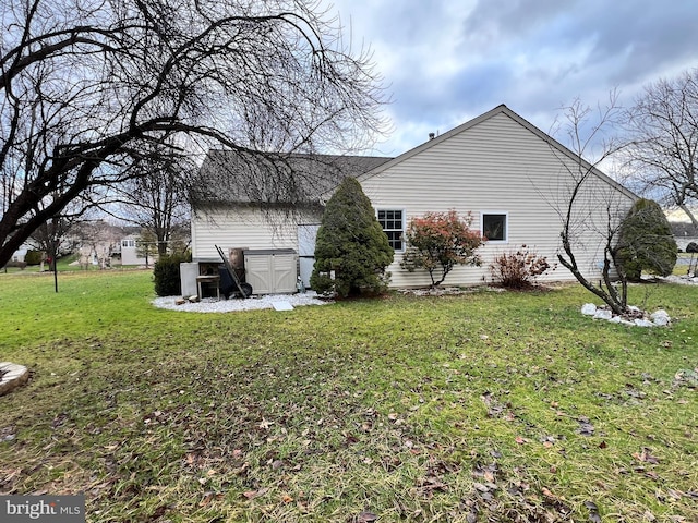 view of home's exterior with a lawn