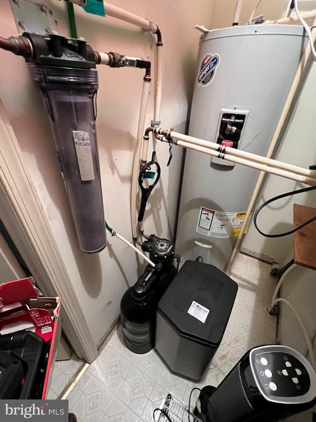 utility room featuring water heater