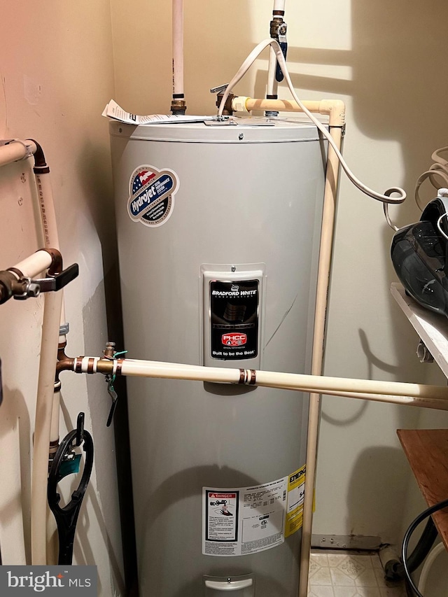 utility room with electric water heater