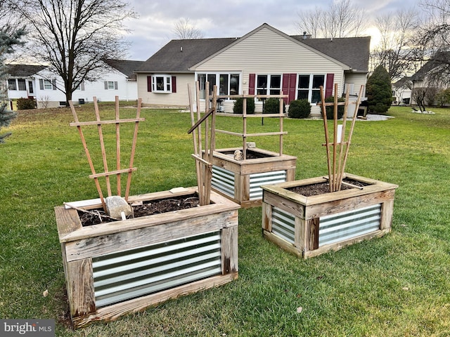 back of house with a lawn