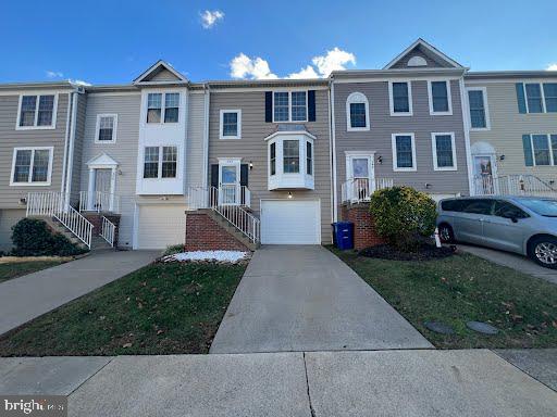 multi unit property featuring a garage