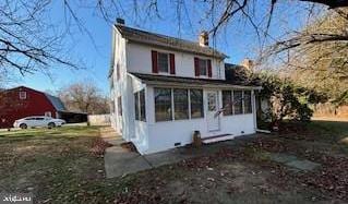 back of property featuring a sunroom