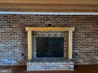 details featuring a fireplace and hardwood / wood-style floors