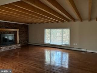 unfurnished living room with a fireplace, beam ceiling, a baseboard heating unit, and wood-type flooring