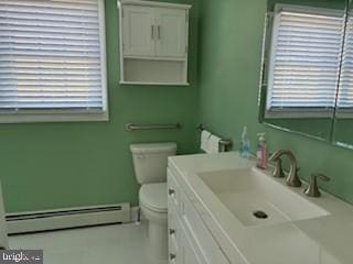 bathroom with vanity, a baseboard radiator, and toilet