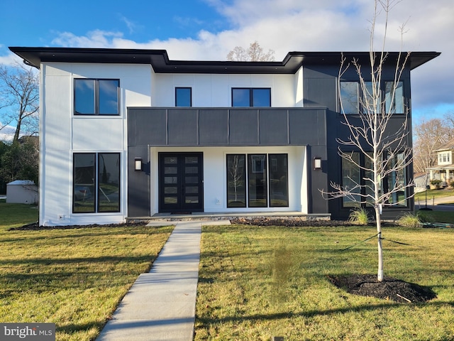 contemporary home featuring a front lawn