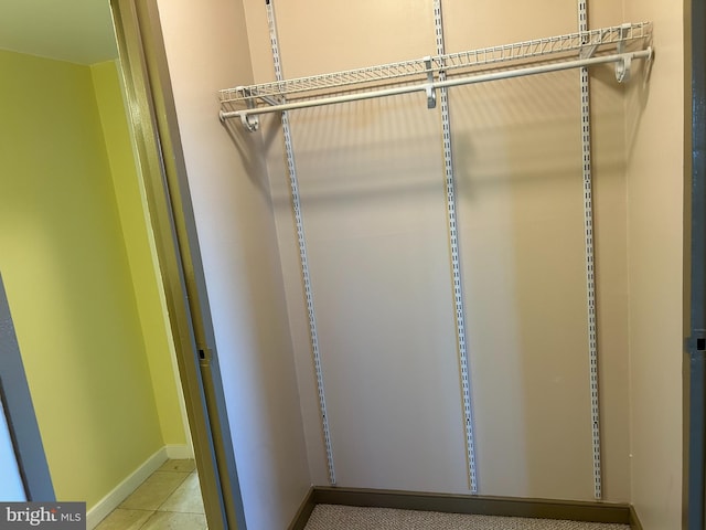 walk in closet featuring light tile patterned floors