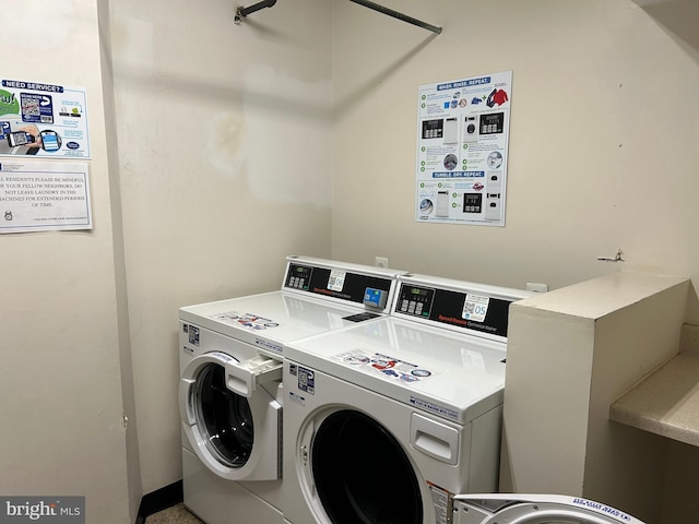 washroom with washer and dryer