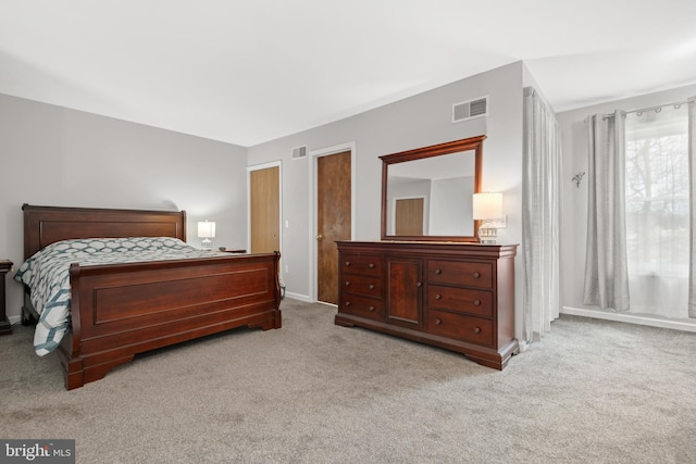 bedroom featuring light carpet