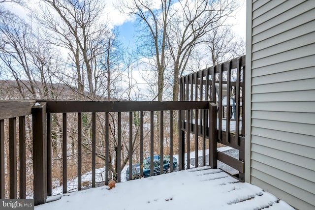 view of snow covered deck