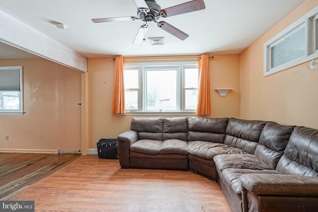 unfurnished living room featuring light wood-type flooring and ceiling fan