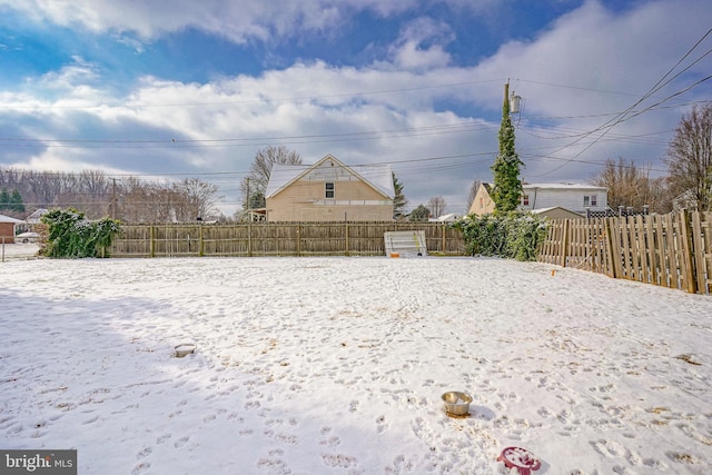 view of yard covered in snow