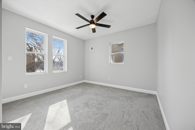 carpeted empty room with ceiling fan