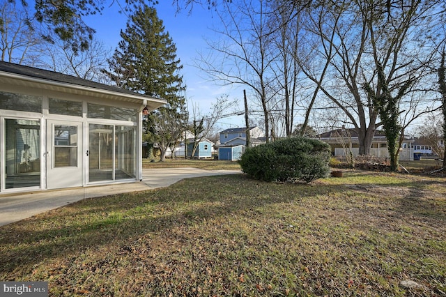 view of yard with a sunroom