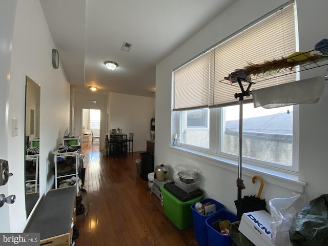 hall with dark hardwood / wood-style flooring