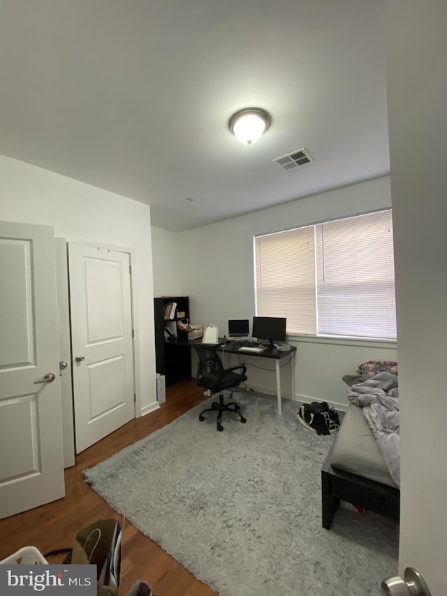 office space featuring hardwood / wood-style floors