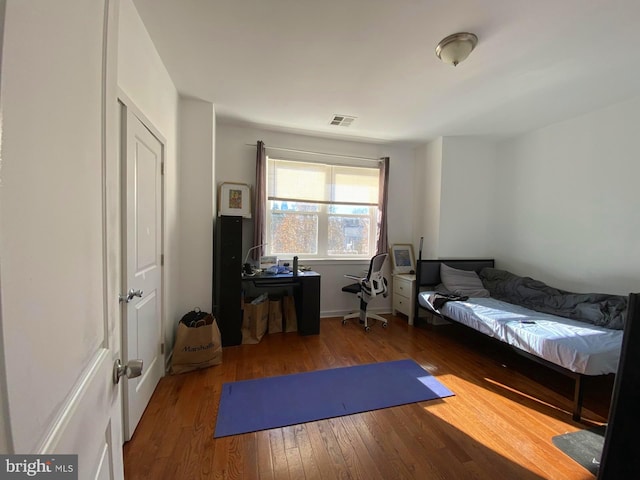 workout area featuring wood-type flooring