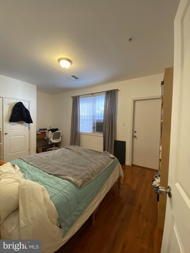 bedroom featuring dark hardwood / wood-style floors