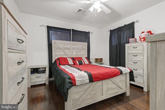 bedroom featuring ceiling fan and dark hardwood / wood-style floors