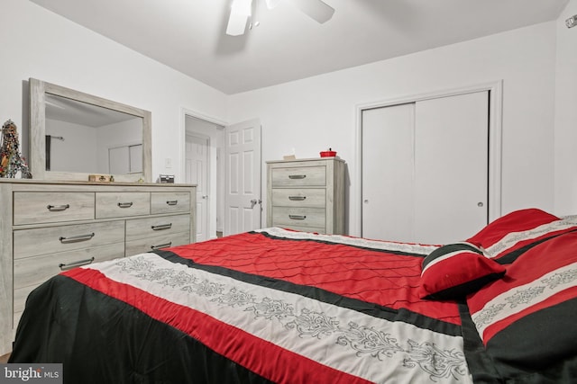 bedroom featuring ceiling fan and a closet