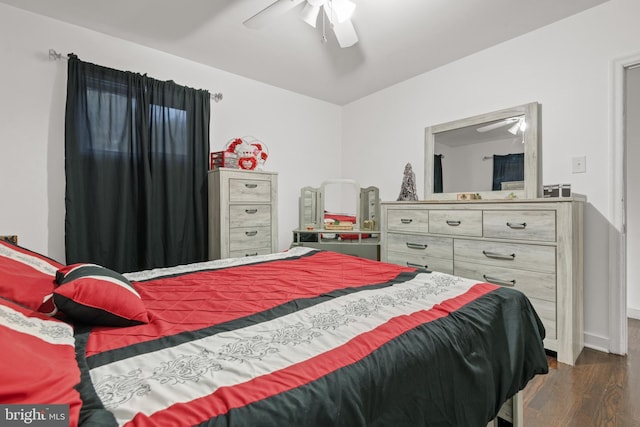 bedroom featuring ceiling fan and dark hardwood / wood-style floors