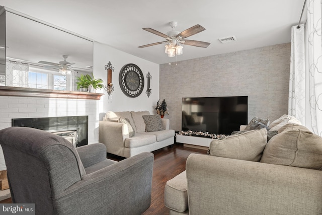 living room featuring dark hardwood / wood-style floors and ceiling fan