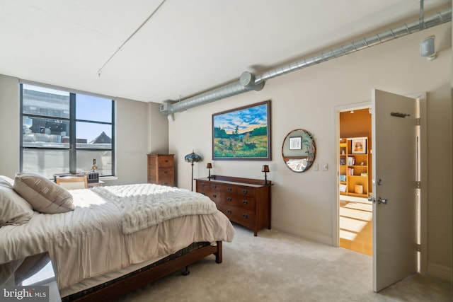 bedroom featuring light colored carpet