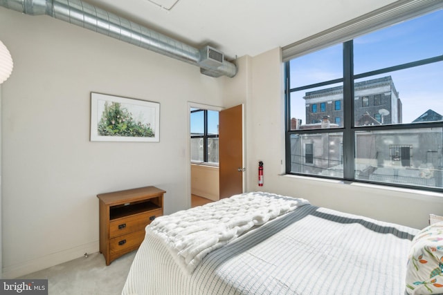 bedroom with light carpet