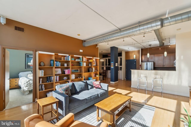 living room with light hardwood / wood-style flooring