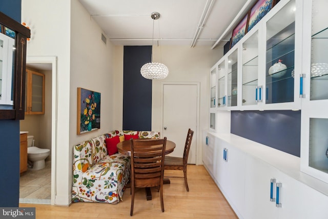 dining area with light wood-type flooring