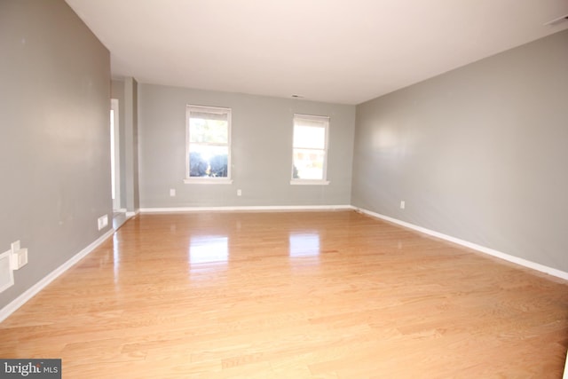 unfurnished room featuring light hardwood / wood-style floors