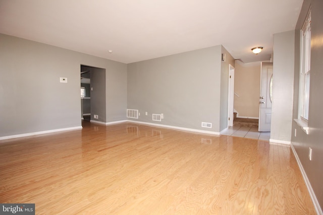 spare room featuring light hardwood / wood-style flooring