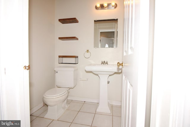 bathroom featuring tile patterned floors and toilet