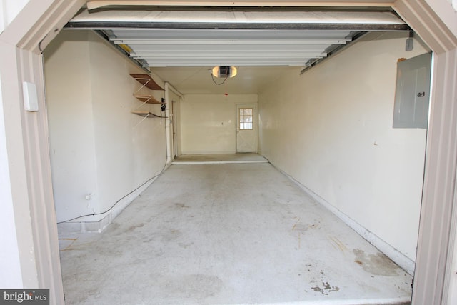 garage featuring electric panel and a garage door opener