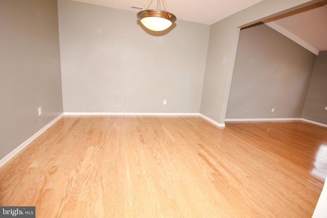 empty room with light hardwood / wood-style flooring