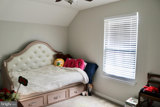 carpeted bedroom featuring ceiling fan and lofted ceiling