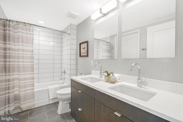 full bathroom with tile patterned floors, vanity, shower / bath combination with curtain, and toilet