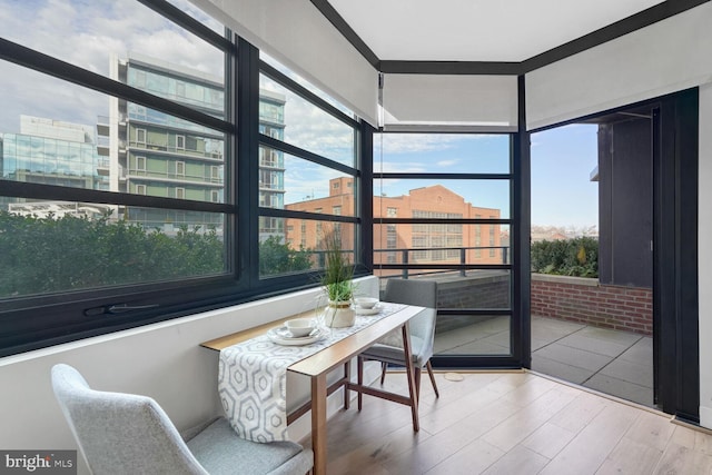 sunroom / solarium featuring a healthy amount of sunlight